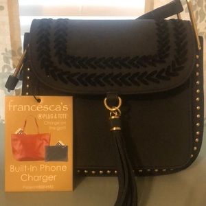 Black handbag with built in phone charger